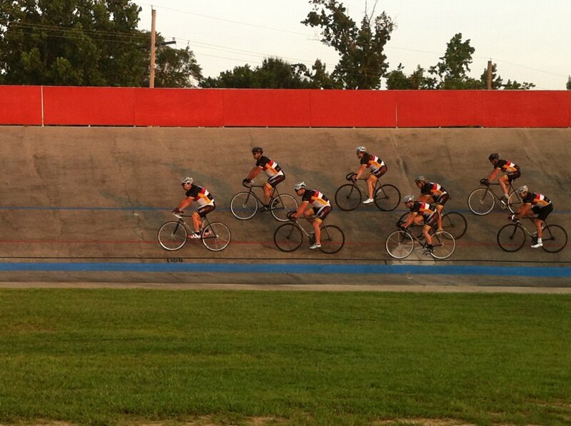 Team in the velodrome at sunset.